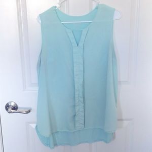 Light teal sleeveless blouse